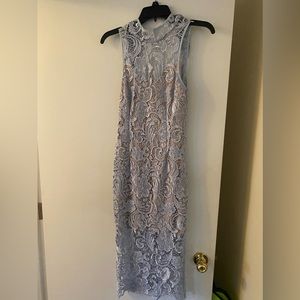 Lace knee length fitted dress and open back